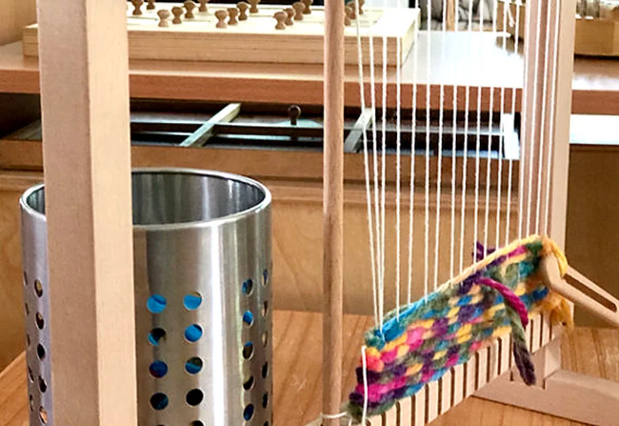 Child-sized loom and handwork material in the Montessori classroom
